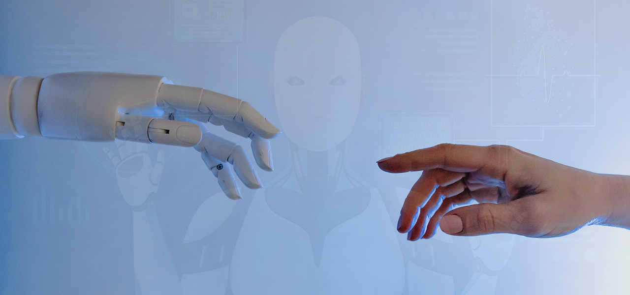 A robotic hand reaching out to touch a human hand, symbolizing the connection between technology and humanity.